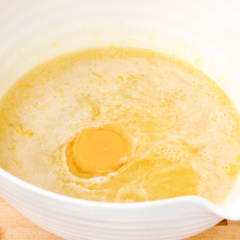 eggs added to margarine mixture in bowl.