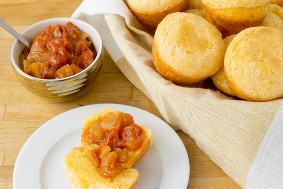 cheese puffs on a plate served with tomato jam