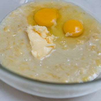 Eggs and margarine in banana mixture.