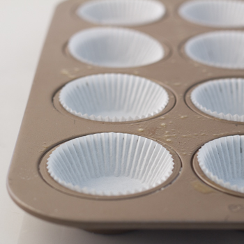 Muffin tin lined with paper cups