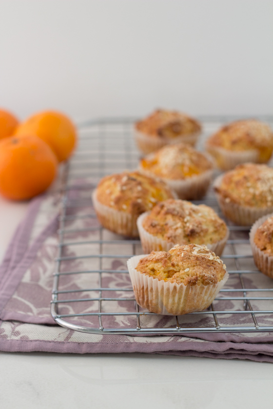 Mandarin sesame muffins on a cooling rack