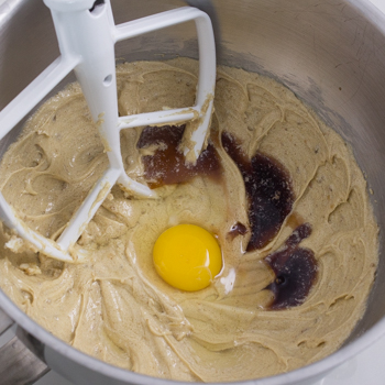adding egg and vanilla to cookie batter